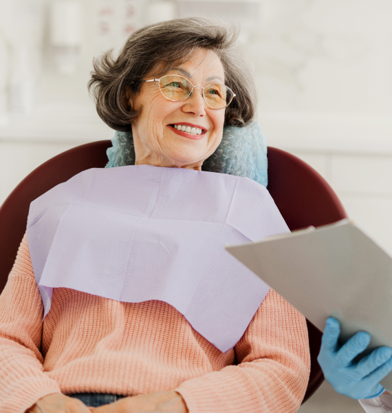Smiling woman outside with healthy teeth